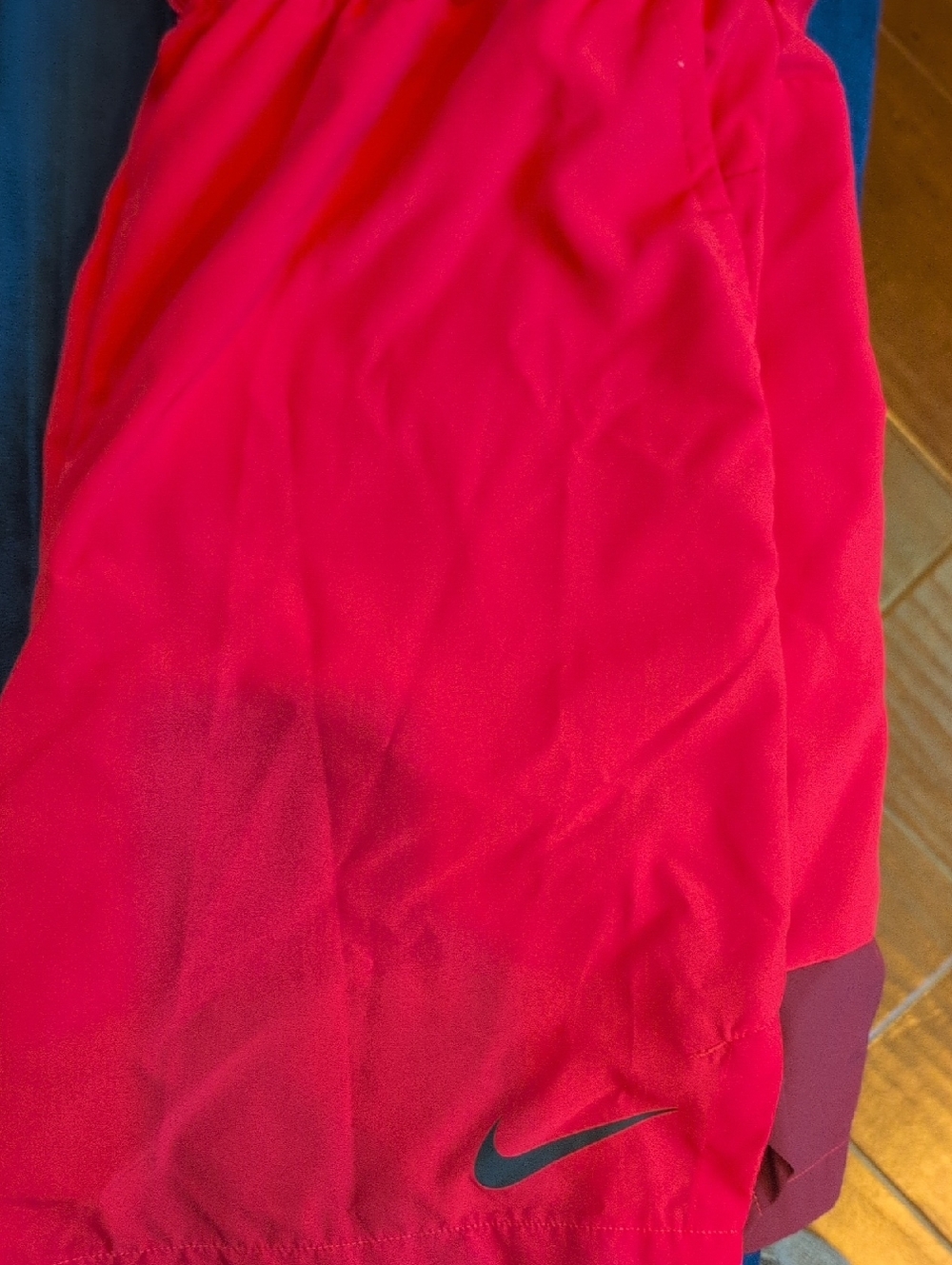Nike Red Athletic Shorts with Black Swoosh